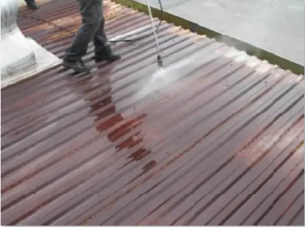 Power washing to remove dirt, oil & grease